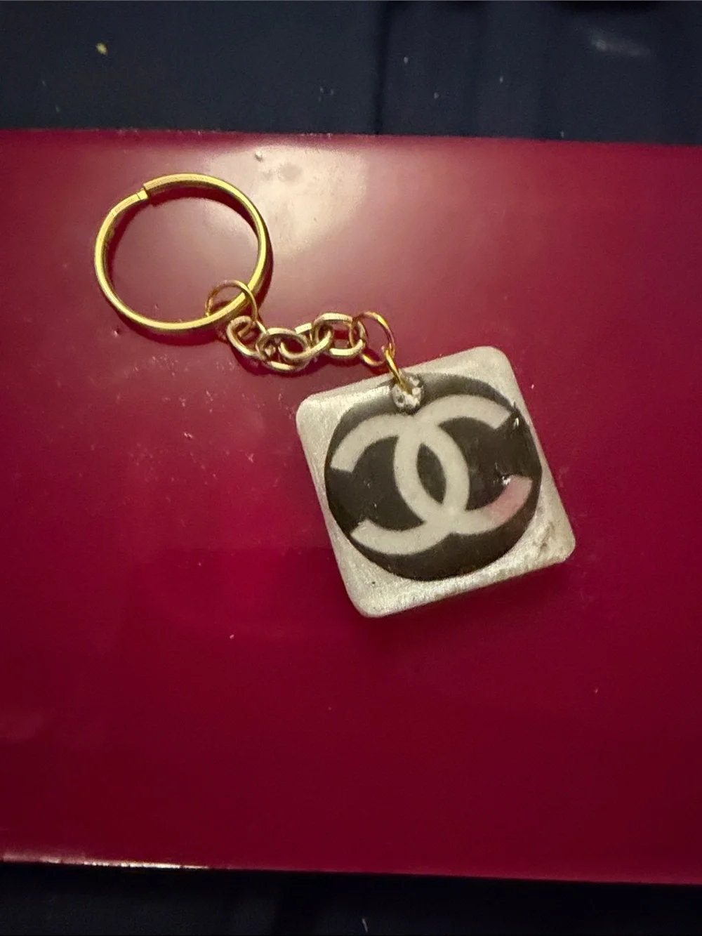 Gold-Tone Keyring with Black & White Interlocking Logo Charm fashion inspired by